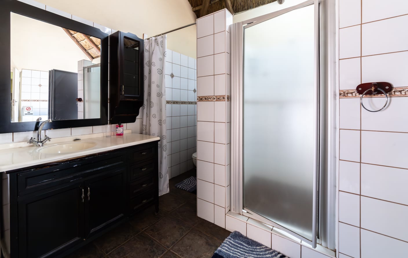 VIP Room 1 amenities - wall-mounted TV, bar fridge, microwave and desk